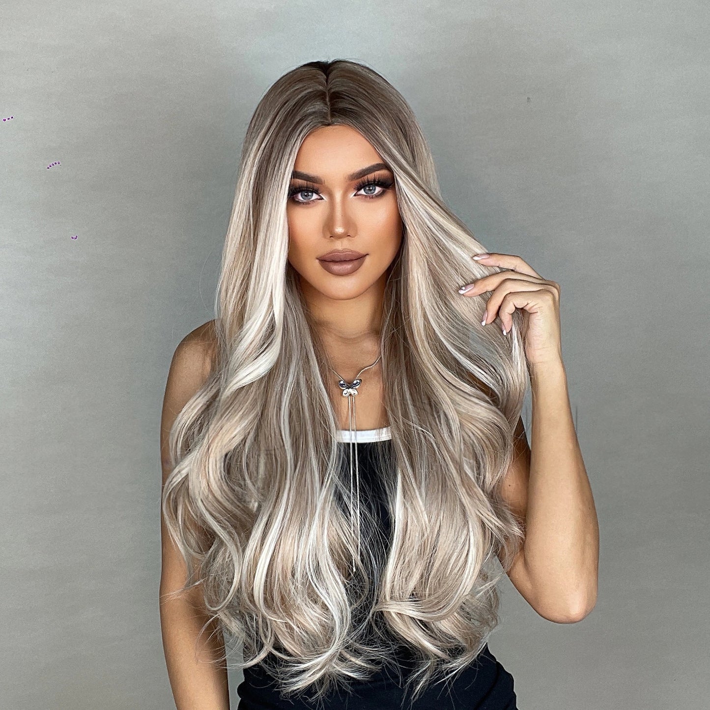 long light ash blonde wavy middle part synthetic wig color close up